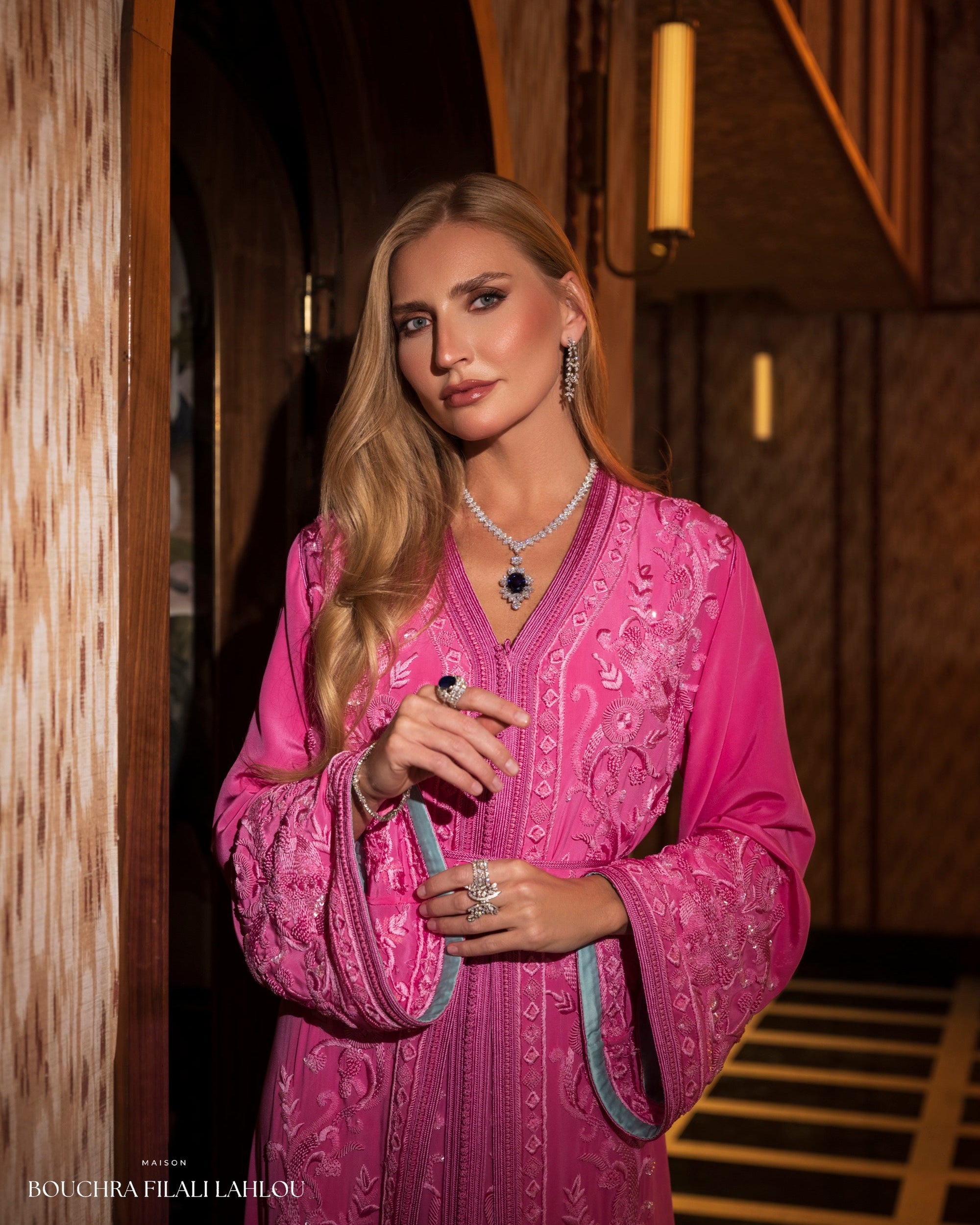 Full length fuchsia kaftan silhouette with refined embroidery and formal Moroccan elegance